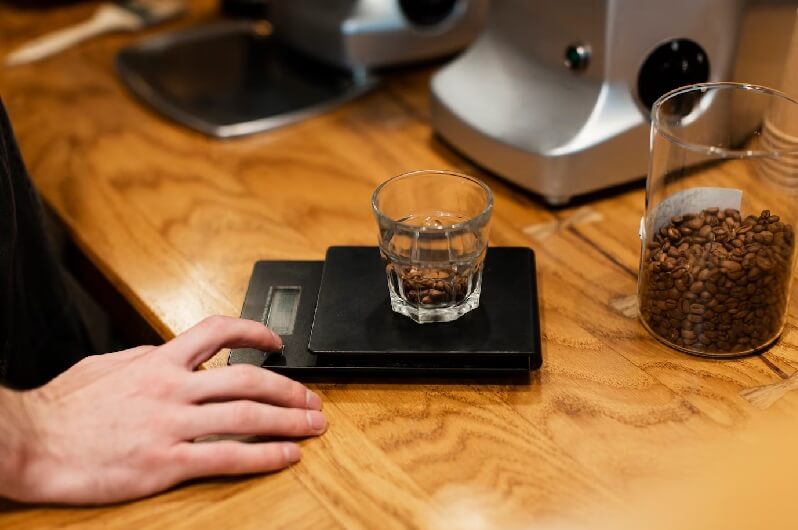 tools for coffee tasting: you will need a scale, a kettle, a spoon, and a cup