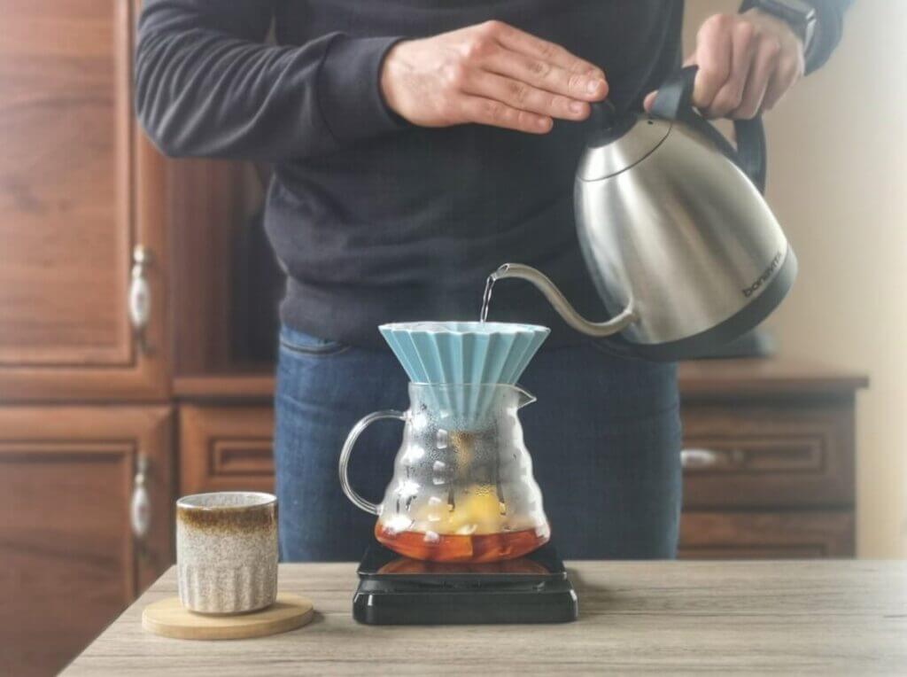making a hand drip coffee with orange