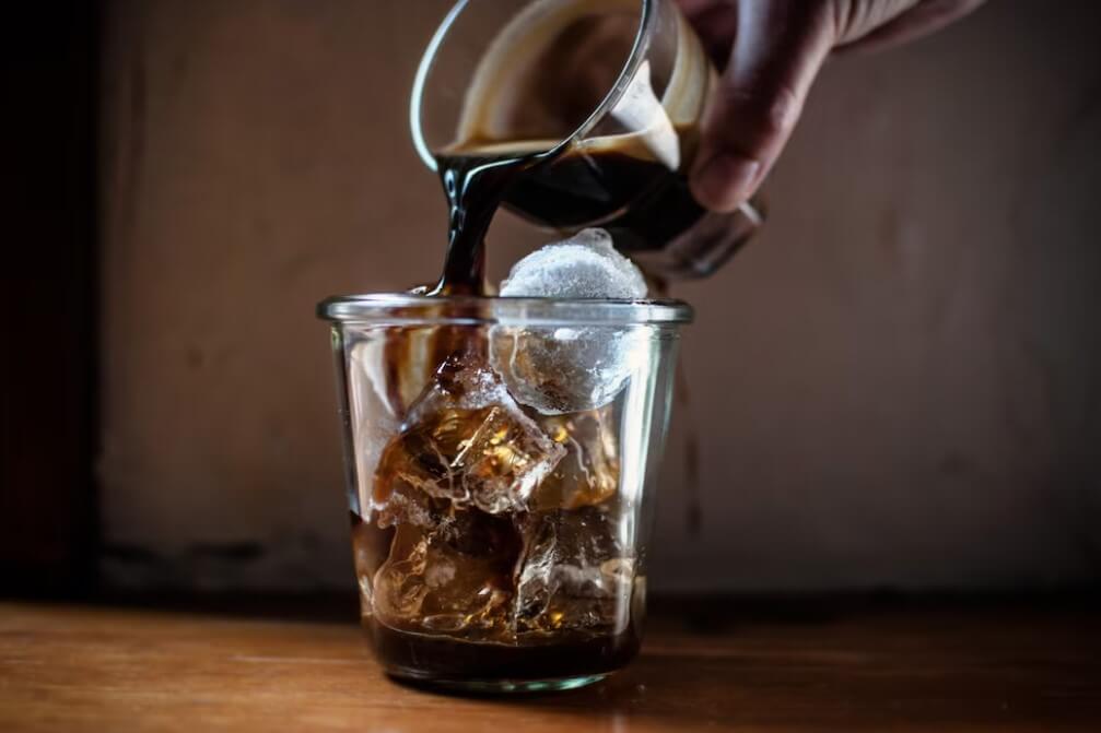 pouring coffee over ice. my espresso iced coffee recipe